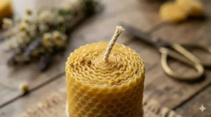 Macro shot of a lead-free cotton wick embedded in a pure yellow raw honey candle.